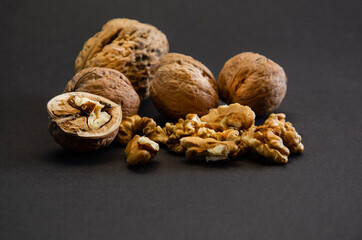 composition of walnuts close-up on a black background