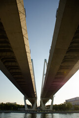 View of the road bridge across the river from below. Vertical photo