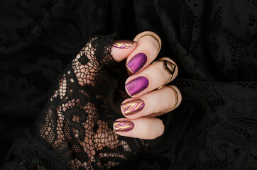 Purple matte manicure with gold abstraction. Holiday rich nail gel design.