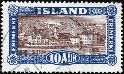 Ancient icelandic postage stamp with a village - obrazy, fototapety, plakaty