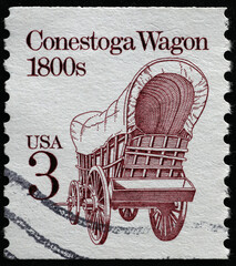 Fototapeta na wymiar Conestoga wagon on vintage american postage stamp