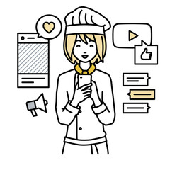 立ってスマートフォンでさまざまなSNSで楽しく交流する調理師の女性
