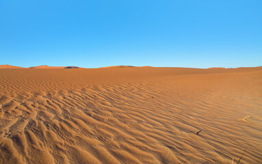 Orange sand dune with blue sky - Sossusvlei, Namib desert, Namibia, Southern Africa