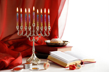 Day 8 of Jewish religious holiday Hanukkah with holiday Hanukkah (traditional candelabra), spinning...