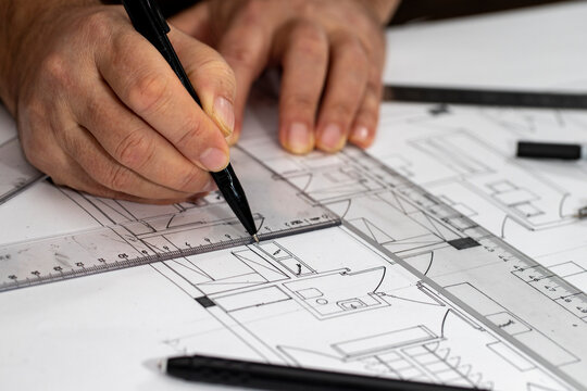 Architect Engineer Design Working on Blueprint Planning Concept. Construction Concept. Selective focus