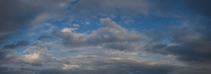 Russia. The South of Eastern Siberia. Gloomy sunset clouds in the evening summer sky over the mountain ranges of Eastern Sayan.