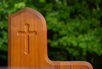 An outdoor church pew on a spring day
