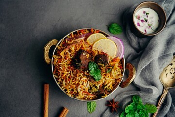 Homemade Mutton lamb biryani served with yogurt raita © vm2002