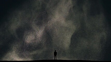 The man stands on snow falling background