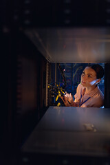 Obraz na płótnie Canvas Caucasian female engineer inspecting the server in computer server room