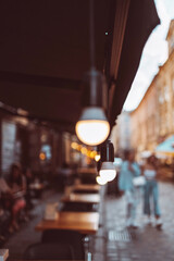 Summer light bulb street decoration at event in a street cafe