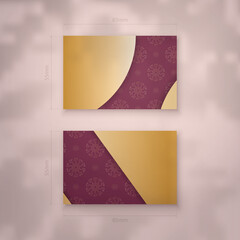Burgundy business card with abstract gold ornament for your brand.