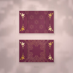 Burgundy business card with abstract gold pattern for your personality.