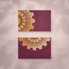 Burgundy business card with luxury gold pattern for your personality.