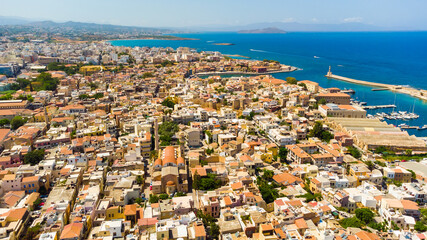 Panoramic aerial view from above of the city of Chania, Crete island, Greece. Landmarks of Greece, beautiful venetian town Chania in Crete island. Chania, Crete, Greece.