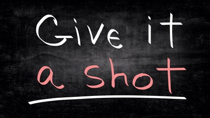 Obraz premium Give it a shot handwritten on a blackboard 