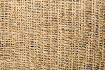 Texture of natural burlap fabric as background, top view