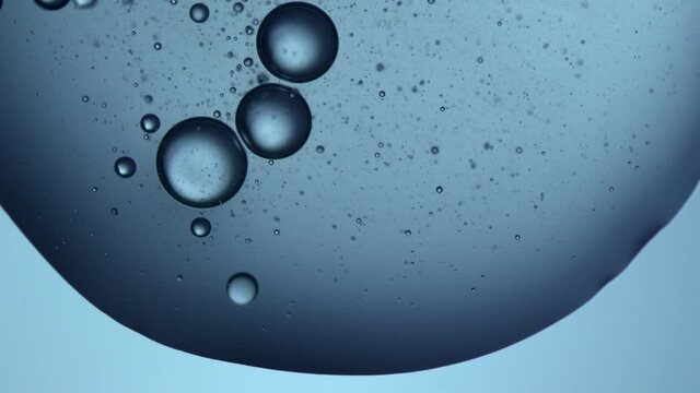 slow motion video of a water droplet falling on a glass plate