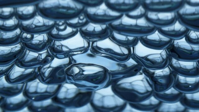 Beautiful slow motion video of a bubble rising to the surface