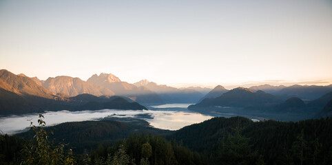 View of sunrise over lake with clouds at Hunter Logging Road Trail, Mission, British Columbia