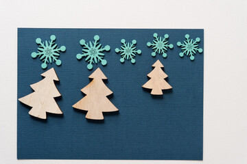 Naklejka na ściany i meble christmas trees and snowflakes on paper