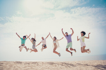 Photo of crazy sporty active friends jump have fun dream weekend wear casual outfit nature summer seaside beach