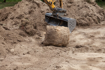 Excavator at work on the construction of a new home