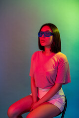 Diverse young female wearing sci-fi eye glasses enjoying internet metaverse isolated on background
