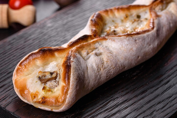 Delicious fresh street pizza with chicken, mushrooms and cheese