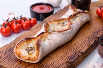 Delicious fresh street pizza with chicken, mushrooms and cheese