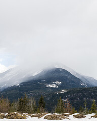 Fototapeta premium Moody landscape early spring with mountains and overcast clouds