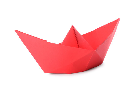 Handmade red paper boat isolated on white. Origami art