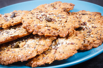 Fresh baked homemade healthy oatmeal cookies on blue plate. Delicious dessert