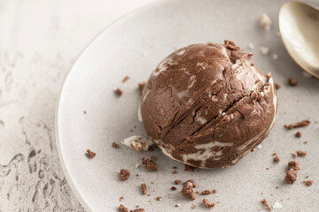 Chocolate vanilla ice cream ball on the white plate .Close up of texture