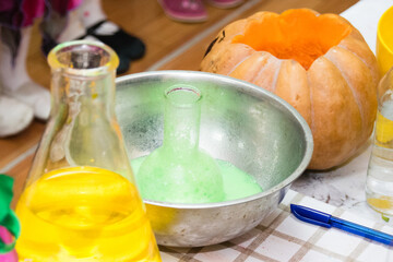 Experiments with chemistry for children during the halloween celebration