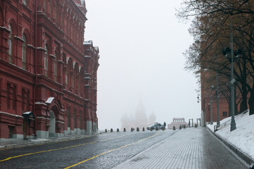 Police car on red square on a foggy winter morning. Foggy winter morning in Moscow.
