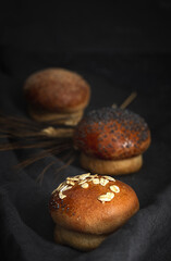 Assortment of small round brioche buns with homemade seeds