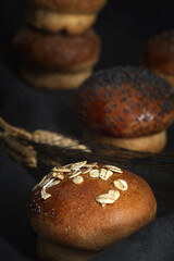 Assortment of small round brioche buns with homemade seeds