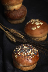 Assortment of small round brioche buns with homemade seeds