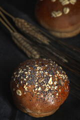 Assortment of small round brioche buns with homemade seeds