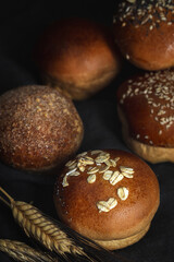 Assortment of small round brioche buns with homemade seeds
