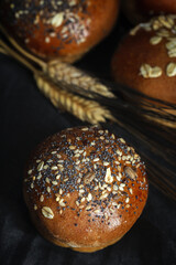 Assortment of small round brioche buns with homemade seeds
