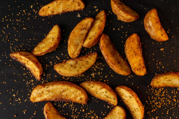 Potato Wedges on black table