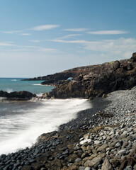 a lone river rock-strewn shoreline along Maui's Southeastern coastline. 