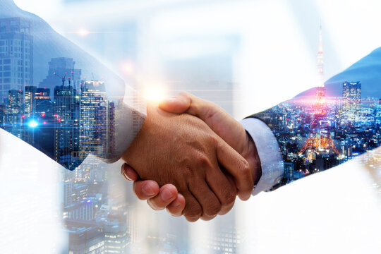 Welcome. double exposure image of investor business man handshake with partner for successful meeting deal with during sunrise and cityscape background, investment, partnership, teamwork concept