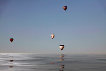 Balloons over water