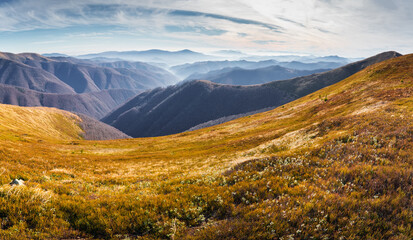 Wonderful sunset in the Carpathians. Mountain travel, freedom and active lifestyle concept. The beauty of the Carpathian Mountains. Bright photowall-paper. Late fall.