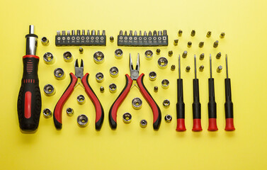 Universal screwdriver set with replaceable bits on a light background.