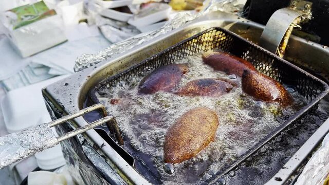 Turkish Food Stuffed Meatballs Boiling in Oil