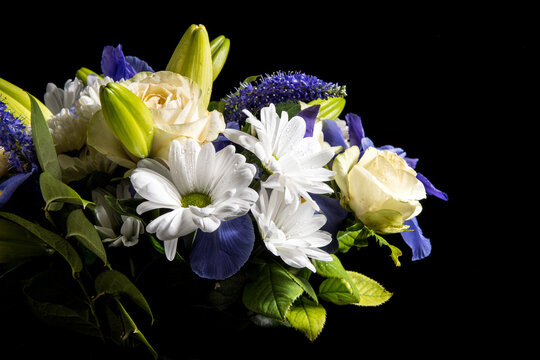 Funeral Bouquet Purple White Flowers, Sympathy And Condolence Concept On Blackbackground With Copy Space.